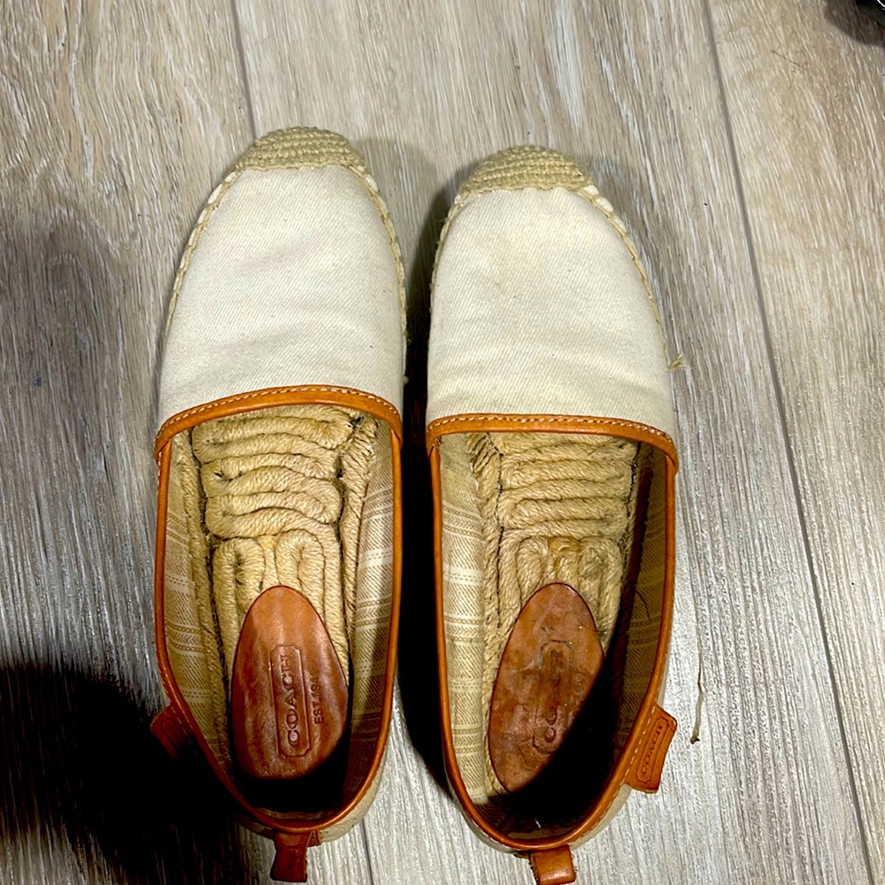 Espadrilles, they are beige with brown leather.